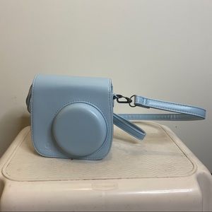 Light blue instax camera crossbody